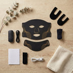 Masque LED Aurore noir et ses accessoires sur travertin