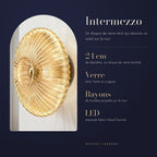 Intermezzo : 24 cm de diamètre, un disque de verre bombé, Verre strié, fumé ou cognac, Rayons de lumière projetés sur le mur