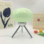 Lampe Scherzo verte, globe en verre teinté et trépied chromé