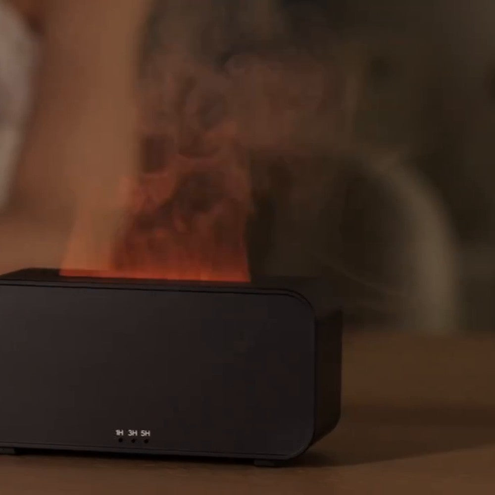 Diffuseur flamme compact Vibrato : sur un bureau