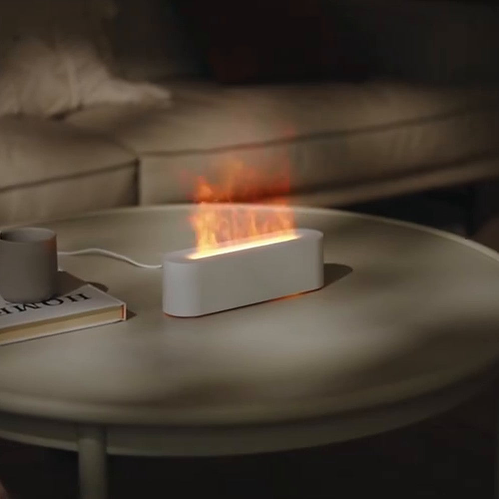 Diffuseur effet flamme Boléro : coloris blanc sur une table basse